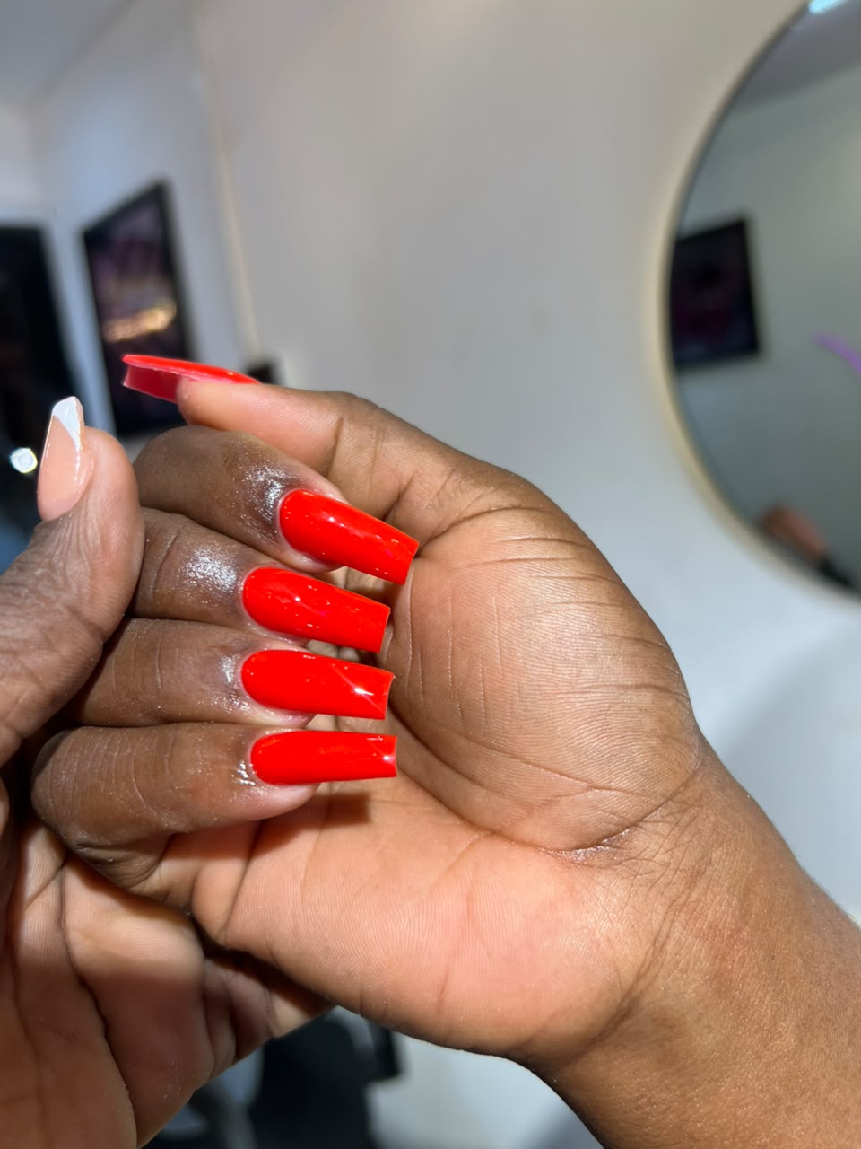 Gel polish nails — long coffin nails in bold red gel polish