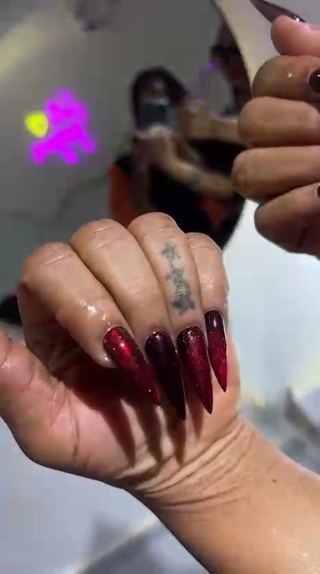 Dark red glittery long stiletto nails
